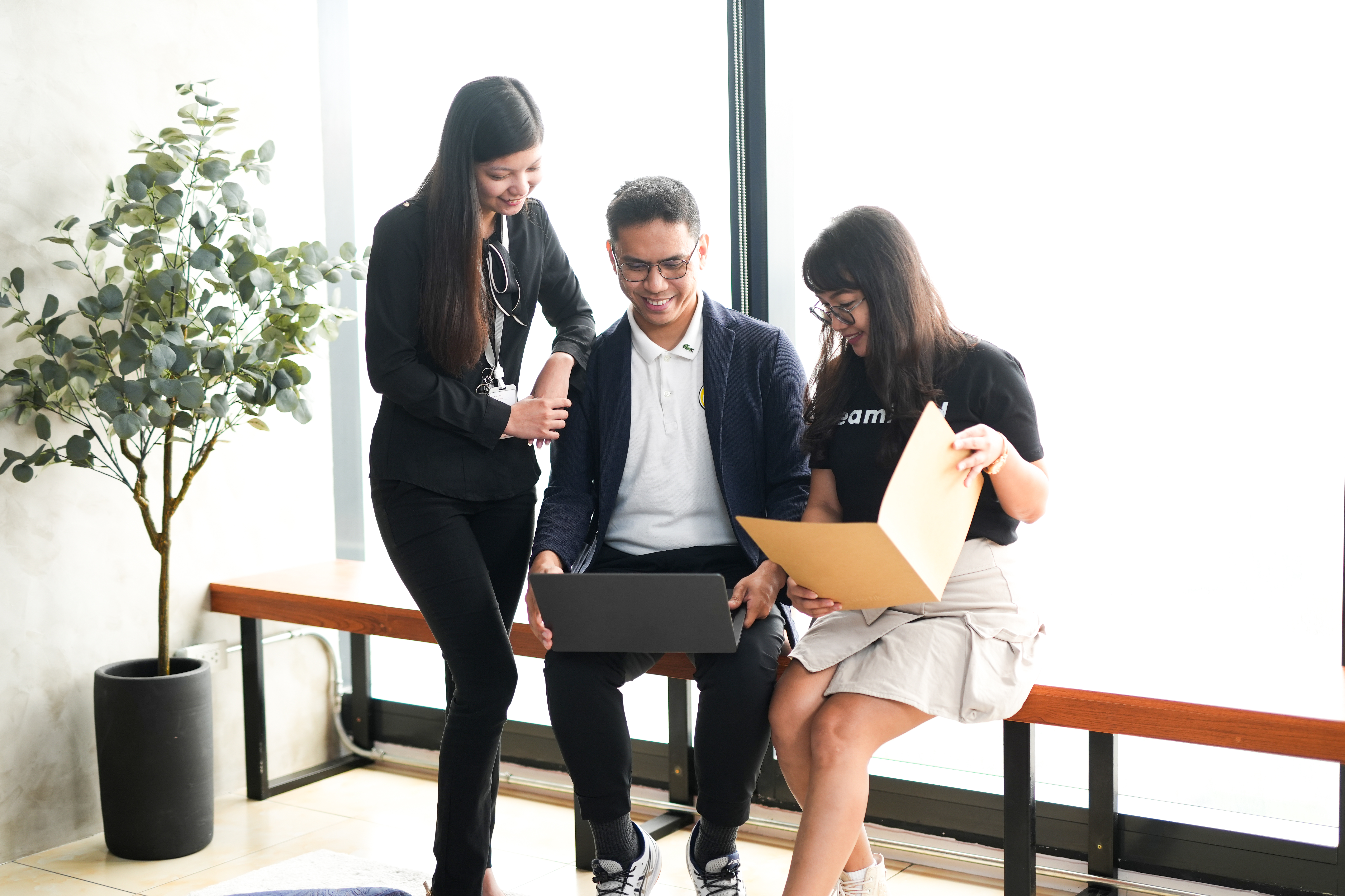Team discussing software development and tech outsourcing roles in a modern office setting